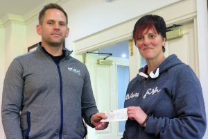 Lee Barnfield (L) presents Liz with a cheque for £150 from Team Smells like Toast's sponsored cycle ride topped up by our Club
